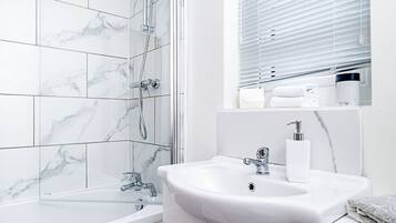 Family House | Bathroom | Combined shower/bathtub, rainfall showerhead, hair dryer, bathrobes