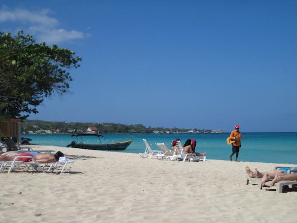 On the beach, sun loungers
