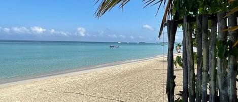 On the beach, sun-loungers
