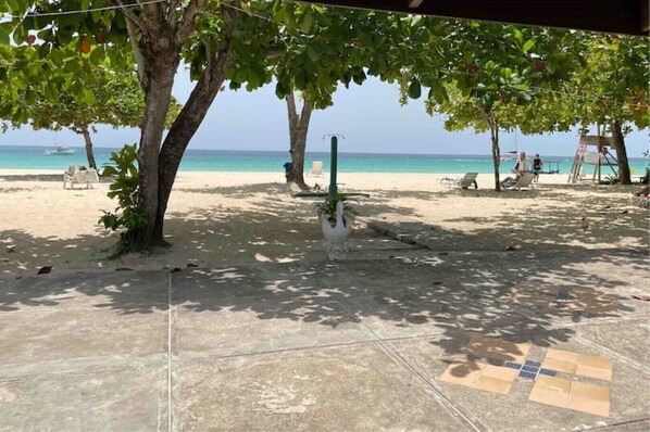 On the beach, sun loungers