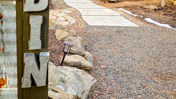 A cabin entrance with a wooden sign spelling "CABIN". - NW Modern, River, Old Mill near Downtown (Bend)