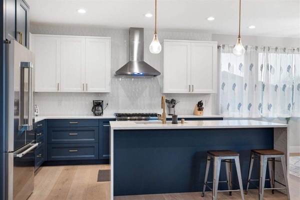 Kitchen perfection meets modern design, blending sleek finishes and bold cabinetry with a space made for cooking, eating, and connecting.