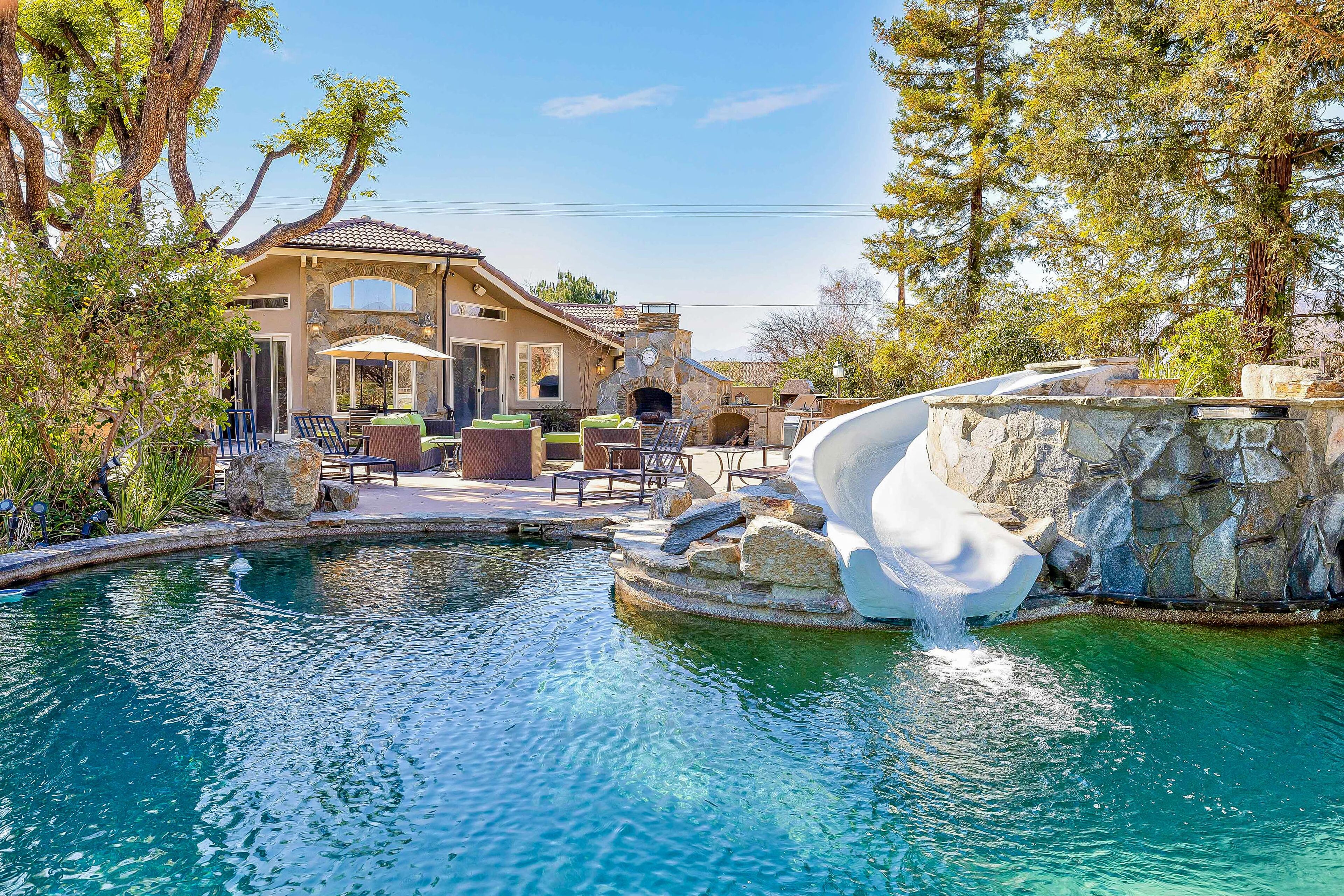 Mansion on 10-acre ranch with private resort-style pool, gym, & theater