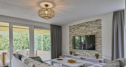 Maison de vacances confortable dans un beau parc