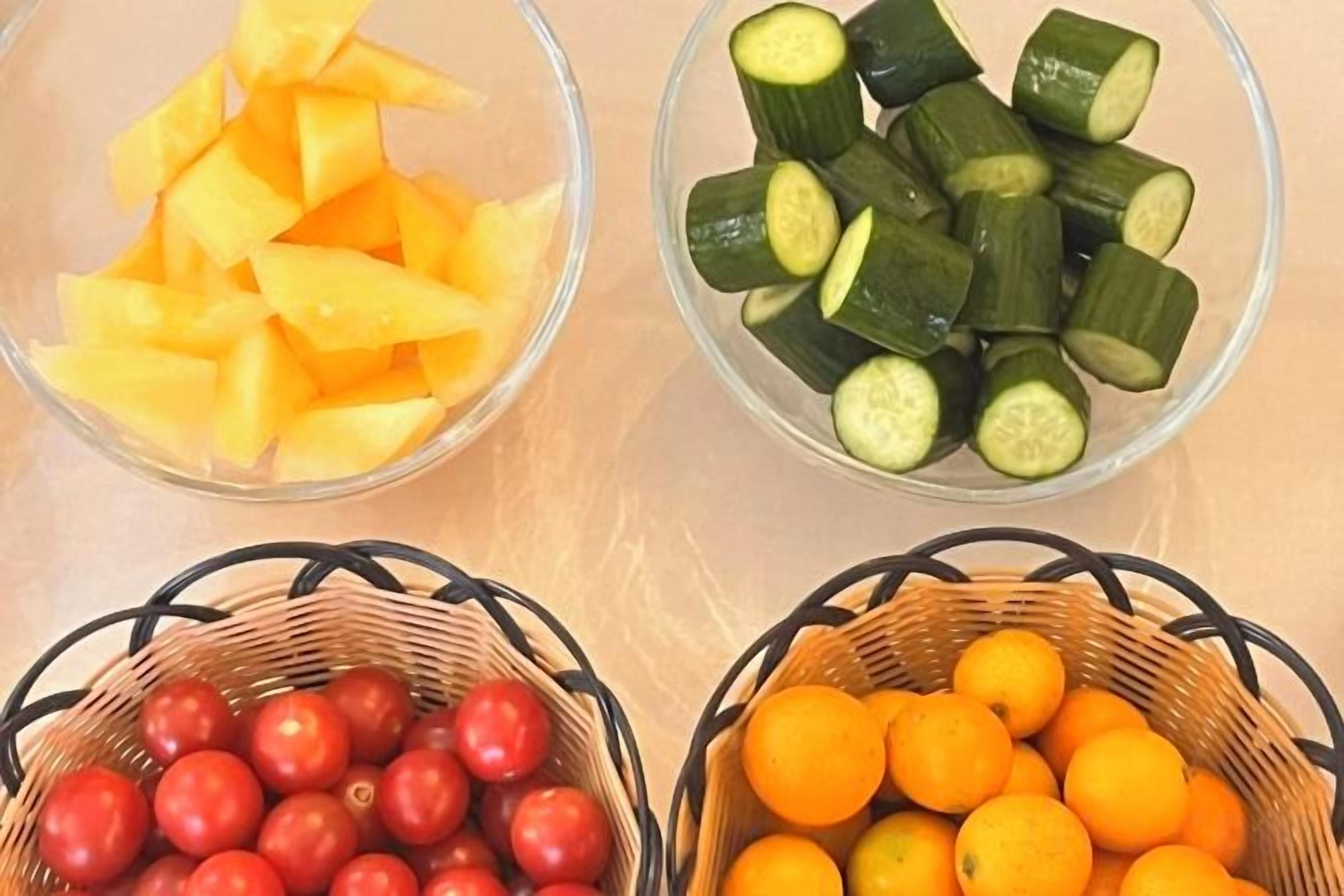 Three bowls with fruits and vegetables.