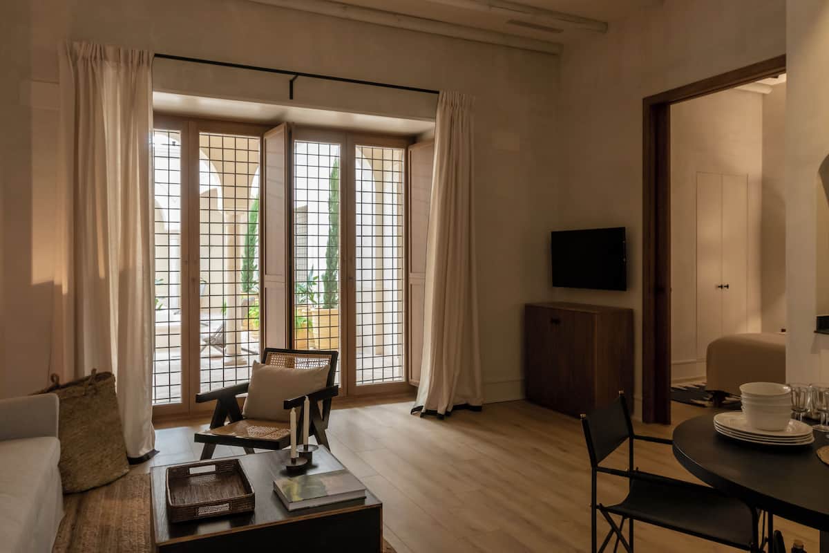 Basic Apartment, Ground Floor | Living area | 32-inch flat-screen TV with digital channels, TV