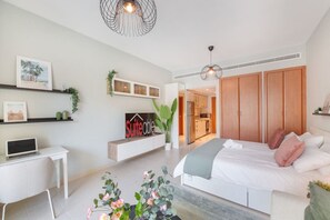 1 bedroom, desk, iron/ironing board, travel crib