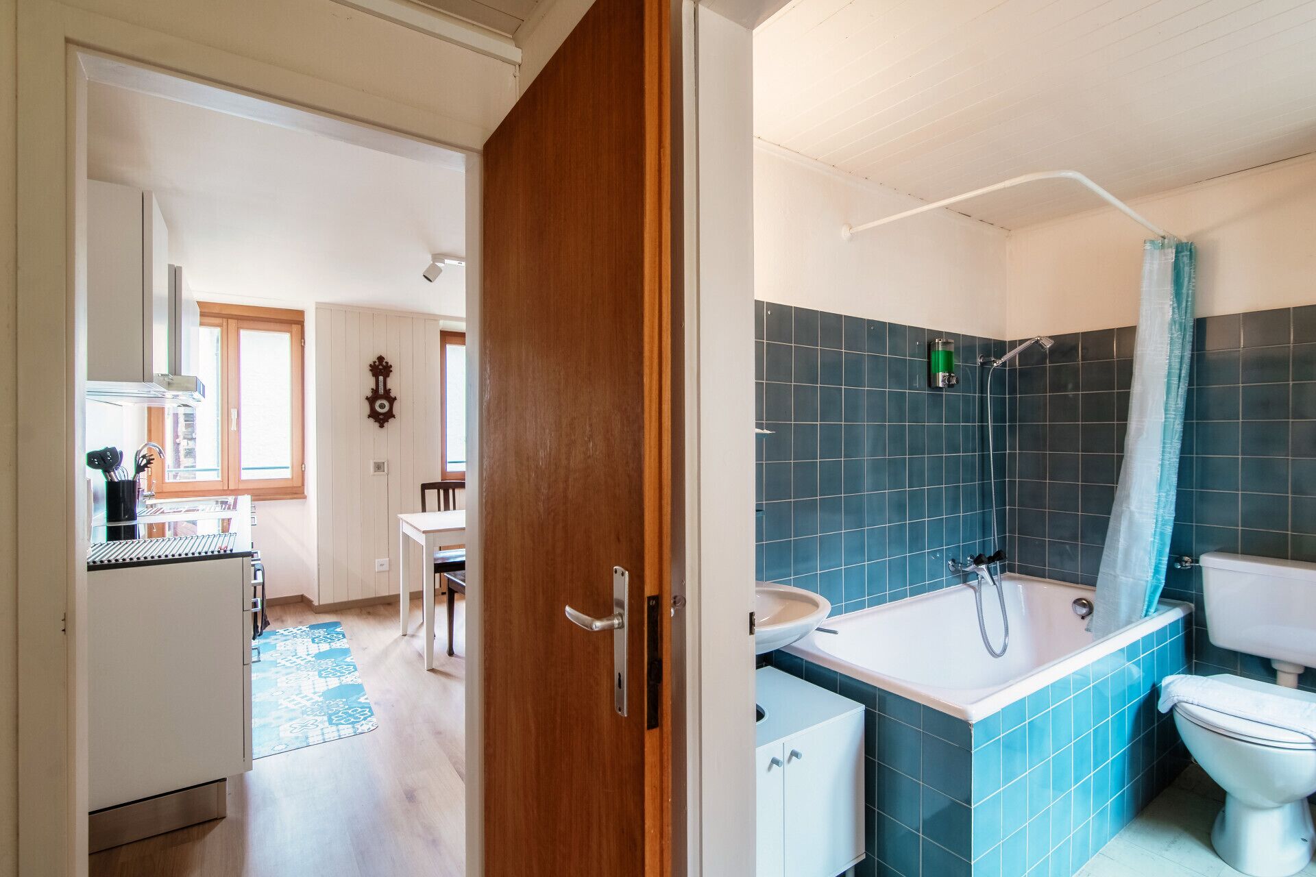 A bathroom with a bathtub, toilet, and shower.