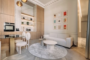 Louvre III | Living area | 100-cm Smart TV with cable channels, fireplace, Netflix