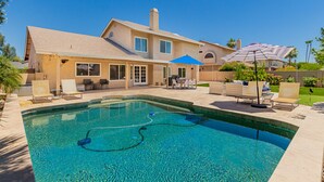 A two-story house with a swimming pool, outdoor seating, and a covered patio area. - *Great Rates Available* | North Scottsdale Peaceful Paradise (Scottsdale)