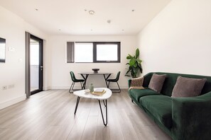 One Bedroom Apartment - Balcony | Living area | 32-inch LED TV with digital channels, TV - Charles Hope Apartments Brentford (Brentford)