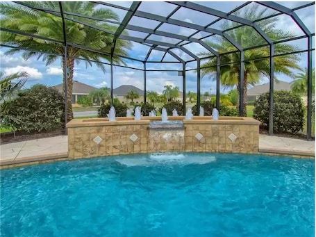 Outdoor pool, a heated pool. Vacation Home with luxurious pool in The Villages, Florida!