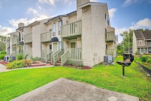 Stylish two-story residence with a flat roof and balconies.