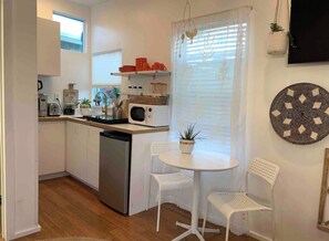 Fridge, microwave, stovetop, coffee/tea maker