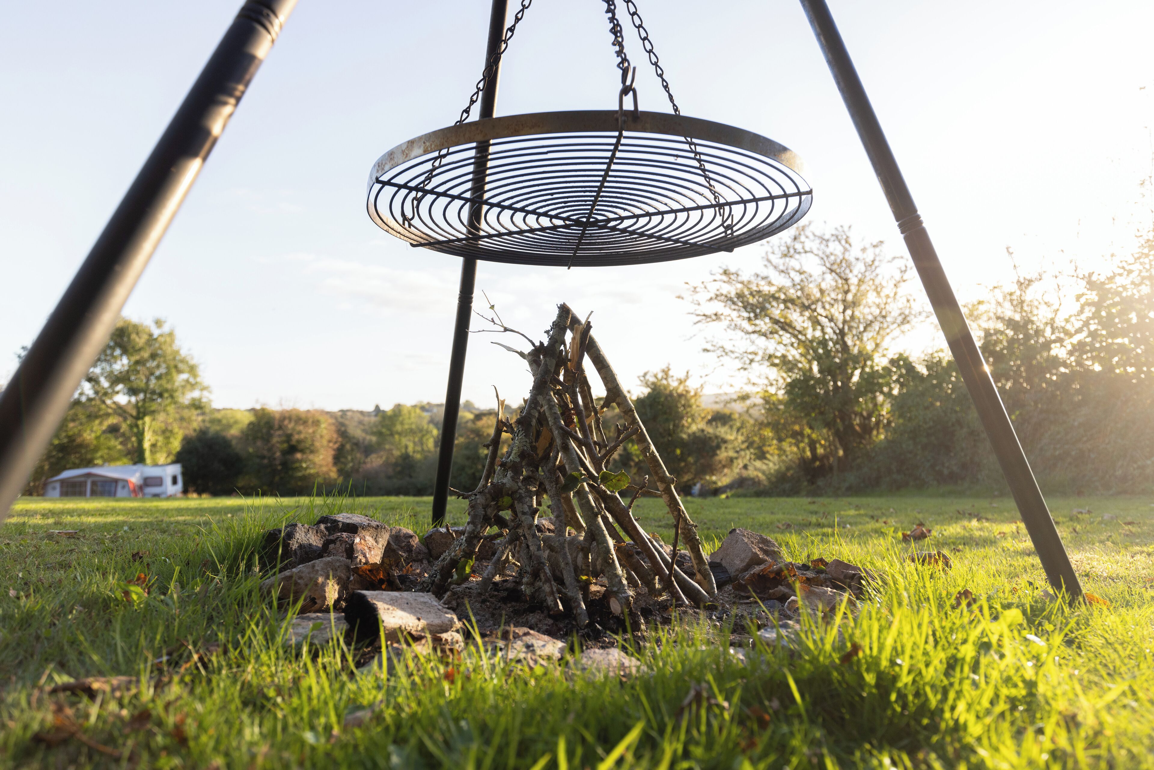 A swing set with a metal seat suspended by chains.