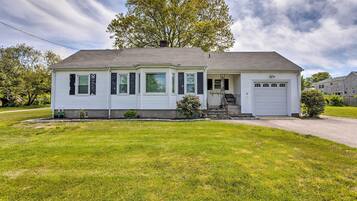 Stylish single-story home with a gabled roof and inviting front porch.