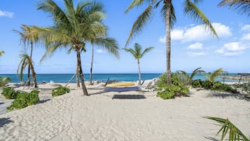 On the beach, sun loungers, beach towels