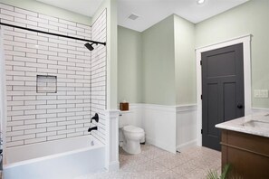 Bathtub, hair dryer, towels, soap