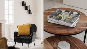 A modern living room with a dark armchair, a yellow throw pillow, and a wooden coffee table with a magazine and coasters. - Top-Class 2BR Apartment in Marousi (Marousi)