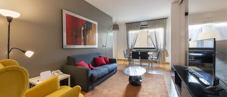 Luxury Apartment | Living area | 40-inch flat-screen TV with digital channels, TV