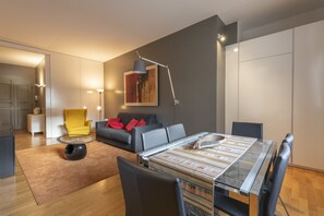 Luxury Apartment | Living area | 40-inch flat-screen TV with digital channels, TV