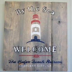 Welcome to The Hoffer Beach Retreat in Crescent City, CA, where the sign sets the tone for a seaside escape.