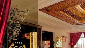 A hotel lobby with a reception desk, red upholstered seating, and a decorative ceiling. - Z Hotel Meknes (Majjate)