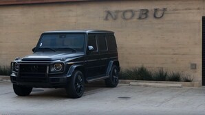 A black SUV parked in front of a building with "NOBU" on the wall. - OCEAN VIEW BUNGALOW - MALIBU, CA (Malibu)