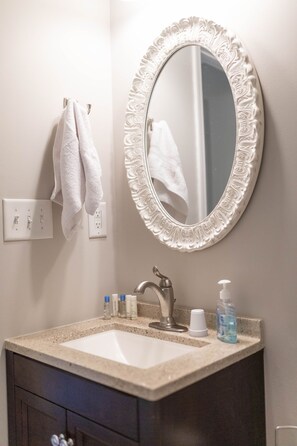 Combined shower/tub, hair dryer, towels, soap