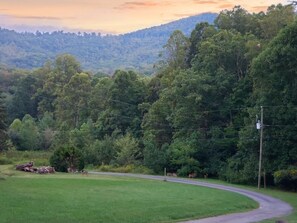 Surrounded by lush greenery and rolling hills, this serene landscape offers a peaceful escape.