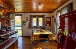 Fridge, microwave, oven, stovetop - Cabin #1 - The Loft - Mackinaw Timbers Cabins (Cadillac)
