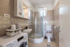 Shower, hair dryer, towels, soap