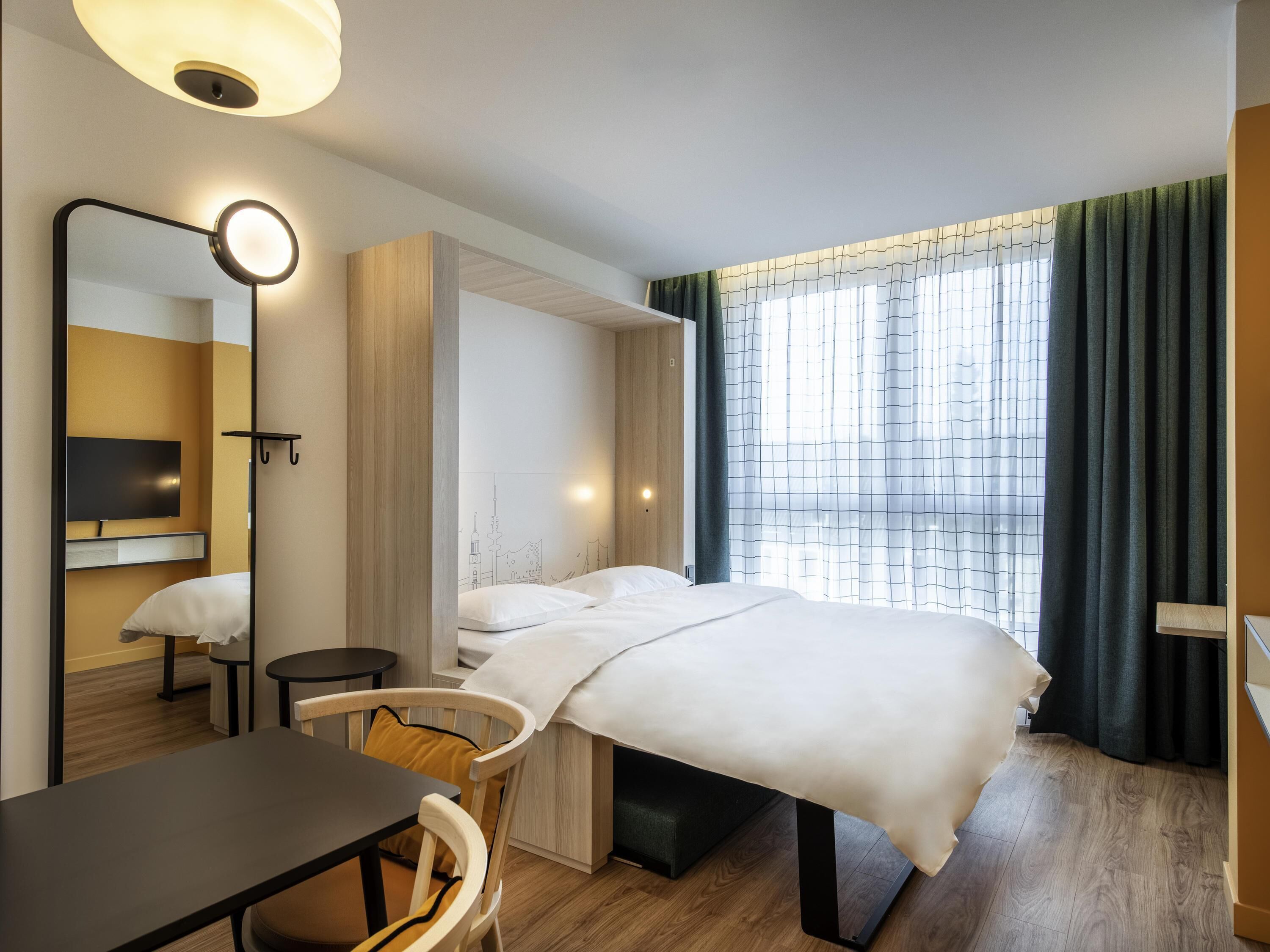 Hypo-allergenic bedding, in-room safe, laptop workspace