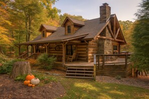 A log cabin with a porch, a chimney, and a deck. - Acre Ridge Cabin (Nineveh)