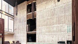 A modern lobby with a high ceiling, a reception desk, and a seating area with a sofa and cushions. - IIK: A Hip Condo-Hotel Oasis in Tulum Centro (Tulum)