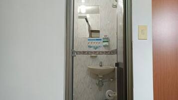 Bidet, towels, soap, toilet paper