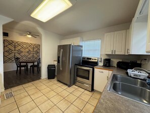 Fridge, oven, stovetop, coffee/tea maker