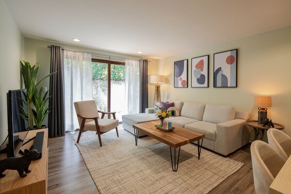 Superior Apartment | Living area | 50-inch Smart TV with cable channels, TV, Netflix