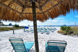 On the beach, sun-loungers, beach towels