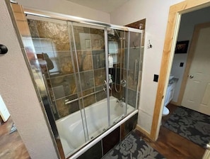 Combined shower/bathtub, hair dryer, towels, soap
