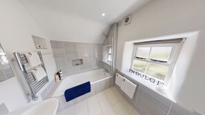 Bathtub, hair dryer, towels, soap