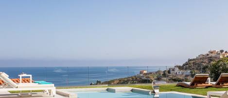 A heated pool, pool loungers