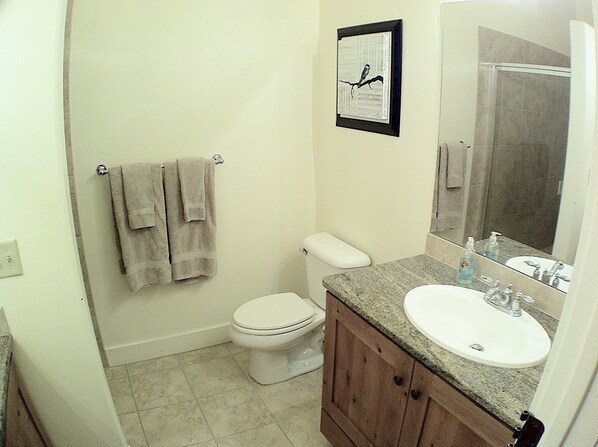 A bathroom with a toilet, sink, and towel rack. - Great Rates, Hot Tub, Tranquil Views & Location (Park City)