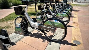 A row of electric bikes with Intermountain Health branding, parked on a paved path with greenery and buildings in the background. - Great Rates, Hot Tub, Tranquil Views & Location (Park City)