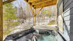A hot tub with a wooden roof and a view of a snowy forest. - Boone Hideaway w/ Deck, Grill & Hot Tub! (Boone)