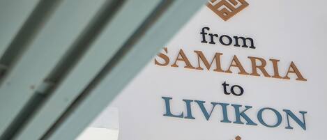 A sign with the text "from SAMARIA to LIVIKON by the sea."