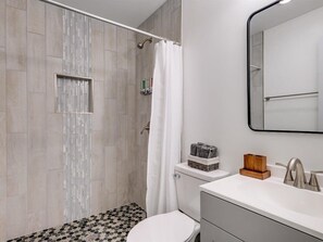 Shower, hair dryer, towels, shampoo
