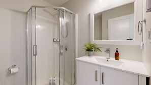 Combined shower/tub, hair dryer, towels, soap