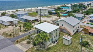 A coastal residential area with houses, a beach, and a clear view of the ocean. - 175 Steps from the Beach, Sweeping Views, Ground Floor (Mexico Beach)