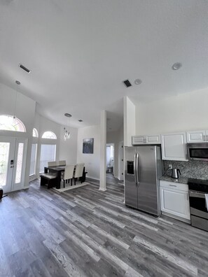 Enjoy cooking in this well-equipped kitchen with a central island and ample counter space.